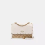 Klare Crossbody In Signature Canvas With Rivets-18838